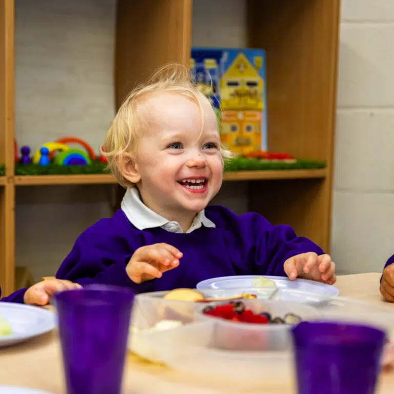 Nursery child enjoying a healthy snack