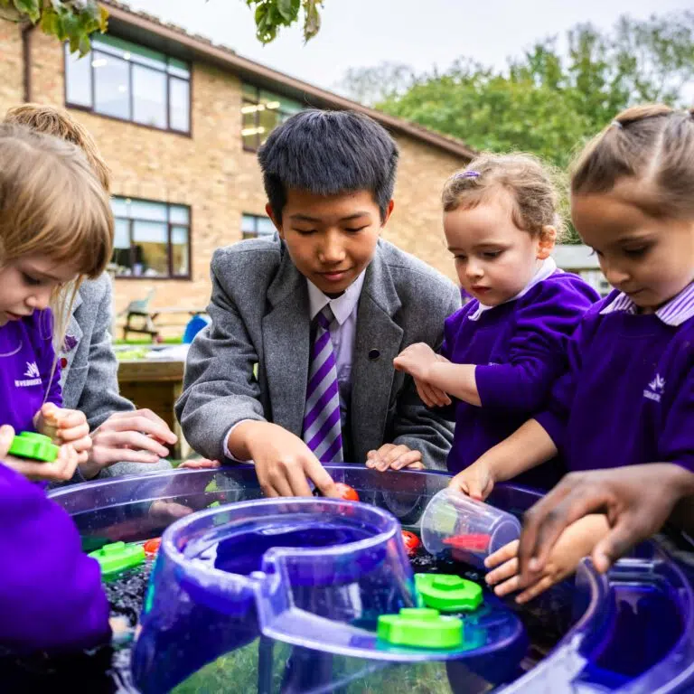 All school ages exploring water play together